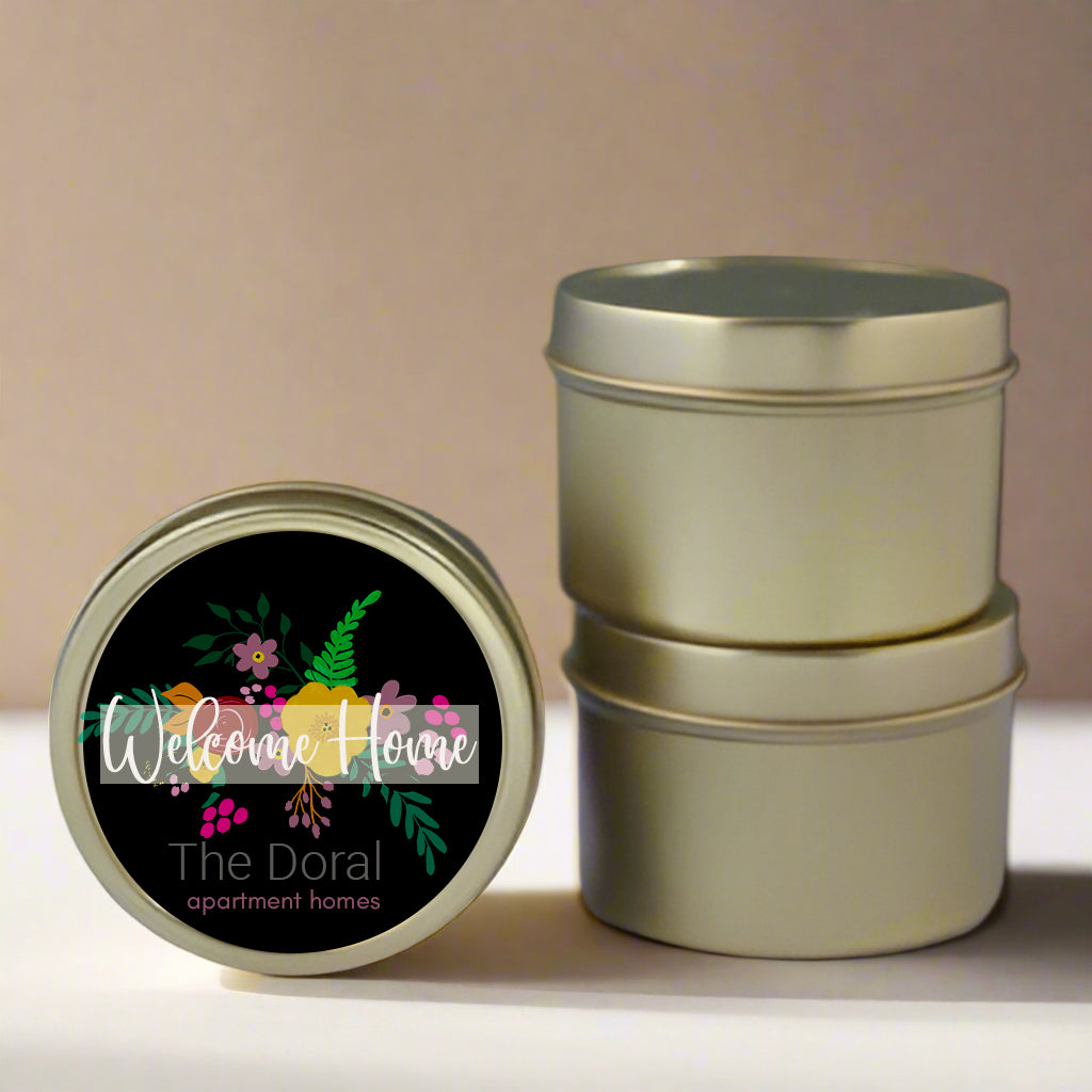 Stack of metal tins with a decorative label on a light background