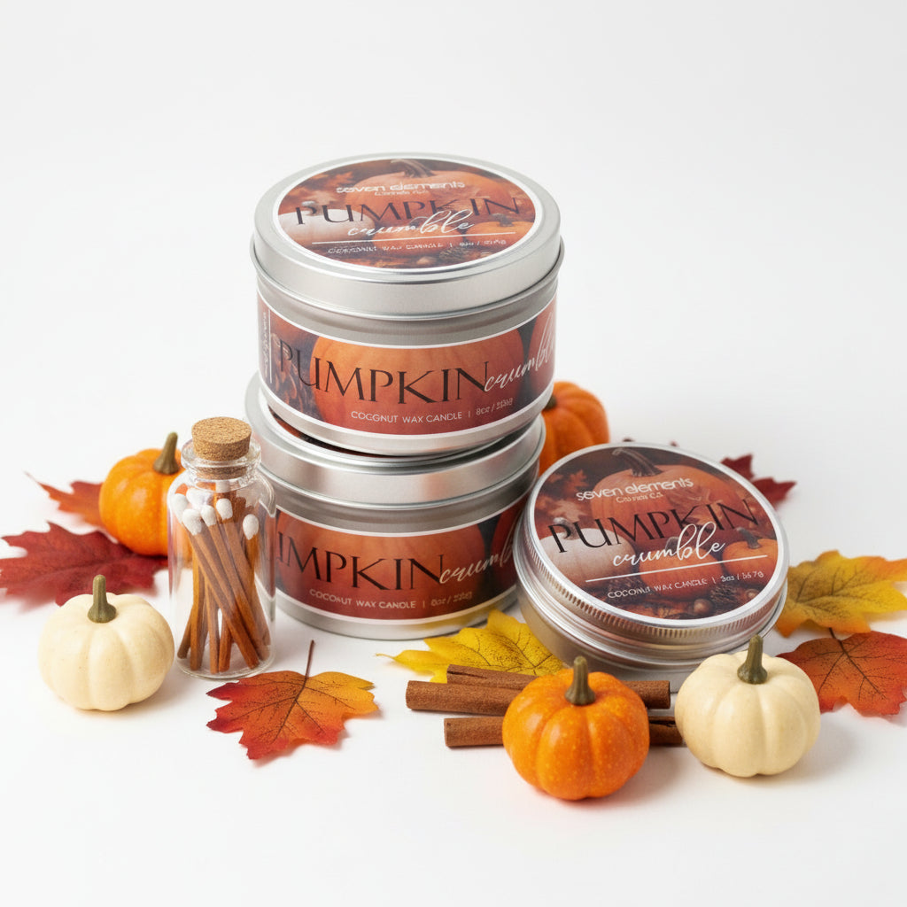 Pumpkin crumble candles with a small bottle of matches on a neutral background